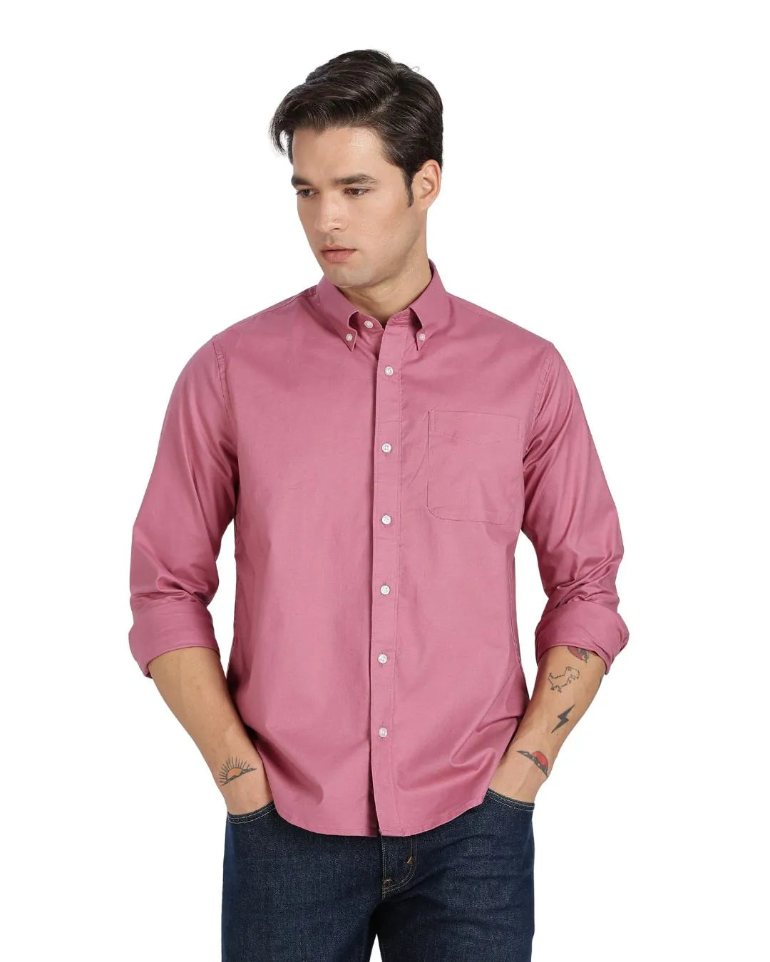 Man wearing a pink button-up shirt on a white background
